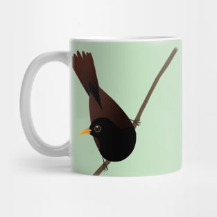 Blackbird sitting on a diagonal branch Mug
